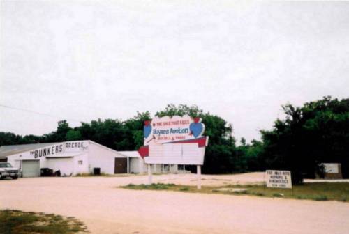 This photo shows the marquee, arcade, and the sign for the auto repair place. I was disappointed about how this photo turned out when scanned, so I did it over. Please see the next photo.