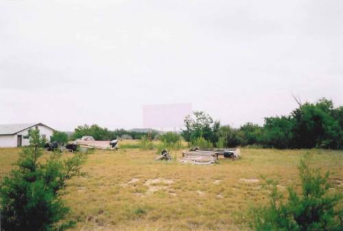 This is near the front of the lot. The concession/projection building is now a residence. The screen blends in with the cloudy sky.