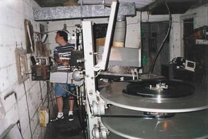 Projectionist focusing the projector at the start of Anaconda.