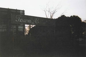 I got to snoopin' around and found this old sign. This drive-in was once called the Town and Country Drive-In.