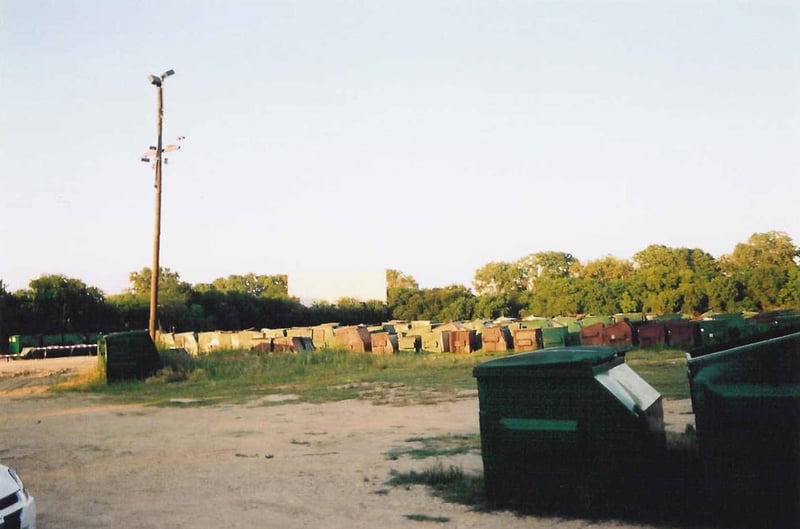 screen and lot with dumpsters