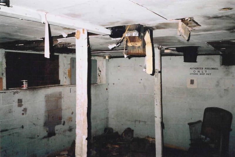 Projection booth with flues for the carbon arc lamphouses in the ceiling. That's a can of Ace non-detergent motor oil on the ledge, probably used in the projector's sound heads.
