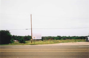 This gives you a good perspective of how close the screen is to the road. The auto repair building is out of the picture to the right.