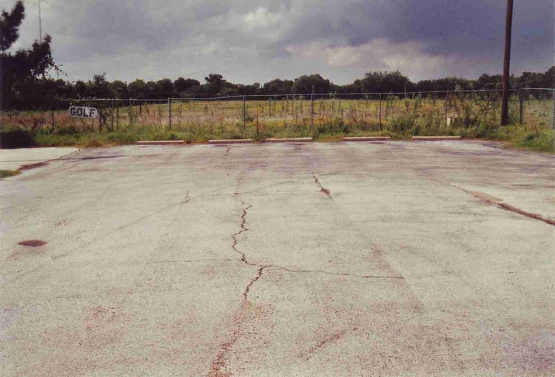 A parking lot for the driving range has been built in front of the field