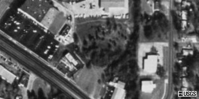 Rose Garden Drive-In. It may have been a little larger from the ariel view in 95. You can still see the floors of it a little.