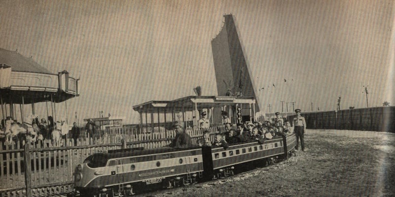 Loews Sharpstown Open-Air Theatre screen tower, merry-go-round,  and kiddie train from the April 7, 1958 issue of Boxoffice magazine.