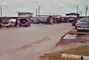 The flea market area begins behind this building