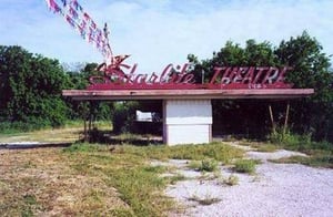 entrance and boarded-up ticket booth(orig. from driveintheater.com)