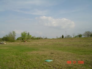 This is looking toward the back of the lot. The lot sloped downward toward the screen which gave the drive-in a stadium seating effect.