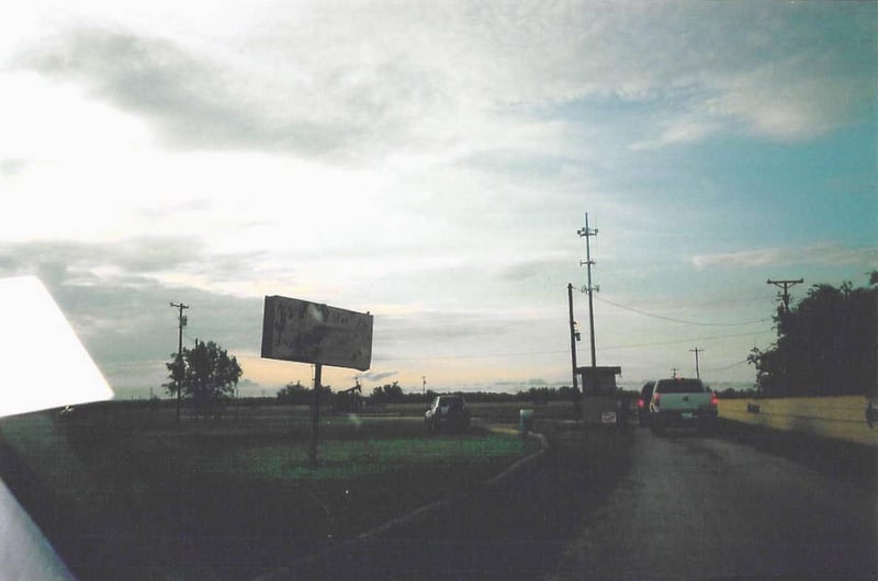 Ticket booth. I think the sign on the left goes back to when the drive-in closed in 1981. It says "Now Showing."