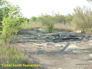 Here's what's left of the Ticket Booth, just the foundation. Appears to have been 2 lanes. This photo was taken April 2004