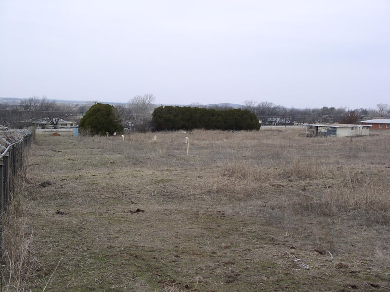 Visable are the Posts marking each row. Concessions/Projection Room to the Right of Photo. Left Background is the Ticket Booth. Photo taken from the Back-road named THEATER ROAD. That fits!