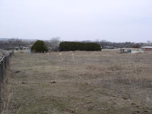 Visable are the Posts marking each row. Concessions/Projection Room to the Right of Photo. Left Background is the Ticket Booth. Photo taken from the Back-road named THEATER ROAD. That fits!