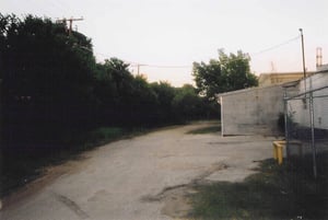 This path runs along the side of the theater. It gets you access to the back screen. I just noticed, the screen is just barely visible in the center portion of the photo behind the telephone pole.