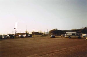 No sign of the drive-in in this picture. This was the drive-in lot, now a parking lot for a series of small businesses and a school.