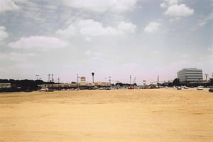 This area was just to the right of the Westview Drive-In. It might have originally been all green area. See the photo from 2002. Most of the stores in this space were closed before being torn down.