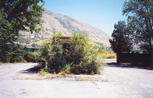 A front view of the ticket booth, almost invisible.