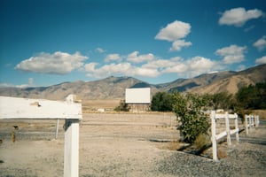 Field with screen tower in the distance