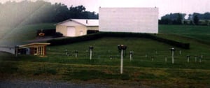 Beautiful lot. Notice the landscaping and how the snack bar building is built into the hillside. screen.