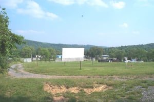 field, screen, and building; taken June 2, 2000