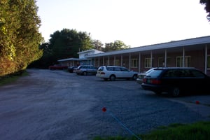 Motel parking lot view.