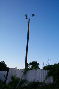 Light tower on one side of the lot.