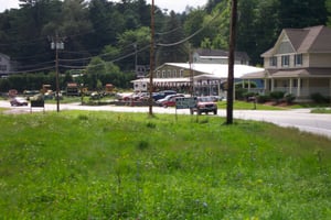 Street view with for-sale sign.