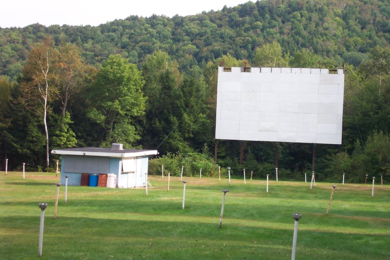 field, projection booth and screen as seen from the rear of the lot