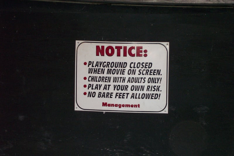 Warning sign posted at the base of screen one.