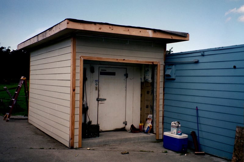 A new walk-in freezer. It's an indoor model so they built a shed over it.