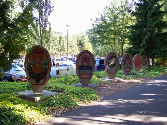 Public art beside the bike trail inside the trees planted for the Duwamish Drive-in. This is historical art, but it doesn't mention the fact that there used to be a drive-in here.