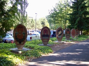 Public art beside the bike trail inside the trees planted for the Duwamish Drive-in.  This is historical art, but it doesn't mention the fact that there used to be a drive-in here.