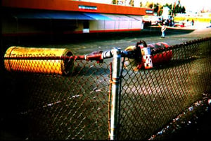 Play yard for the Midway Drive-in after most of the equipment has been removed.  The play yard at this theater was behind the snack bar/projection booth.  In the foreground is a Swiss cheese light shield.