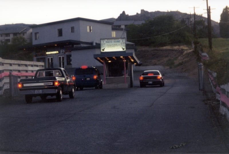 main building and box office with cars entering