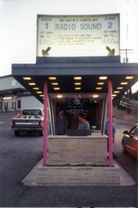 ticket booth; the blank cinder block wall next to snack bar is the original projection booth, now storage