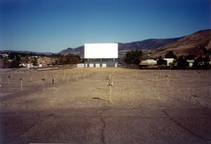 view of the screen and field with speaker poles