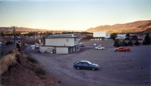 main building, field, and screen in the distance