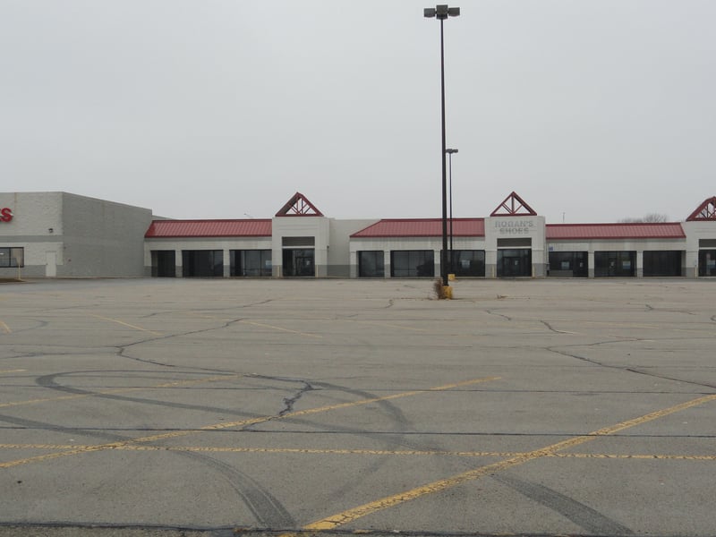 Now empty stores and parking area
