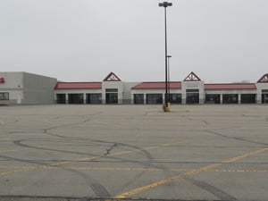 Now empty stores and parking area