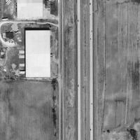 terraserver image of the 57 Outdoor site, located on what is now the frontage road of I-43(formerly Wisconsin 57), 1 mile north of the Wisconsin 32 exit(exit 93). 2 industrial buildings appear to now be on the former site(only the projection building stan