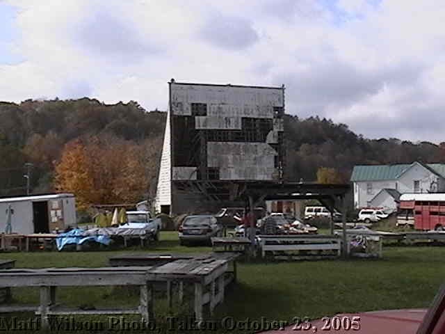 This is how the Bartow Drive-In currently appears, and the grounds are still used for a flea market (as can be seen in the foreground.). Many of the speaker stands are still intact, and some of the old equipment is stored in a building under the screen.