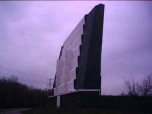 The back of the screen, looking southeast - groovy streamlined scallops - the two vertical lines toward the center were originally clear light bulbs.  Also, the color from the 70's and 80's was dark kidney-red.  The screen used to proclaim KENO DRIVE-IN a