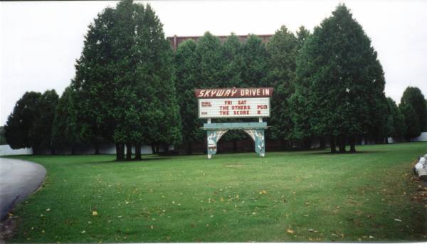 Marquee & rear of the screen (just above the trees)