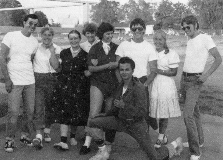 Happy Stardusk patrons wearing 50s attire at a radio station promotion held in '78.