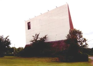 screen, w/a few trees starting to overgrow the lower part of it... (from WI Movies by Starlight)