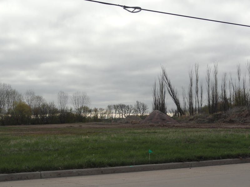 now just an empty field with Nixon Street running through the former site