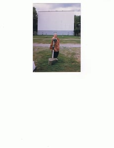 My mother Nancy Foster posing in front of Drive Inn screen