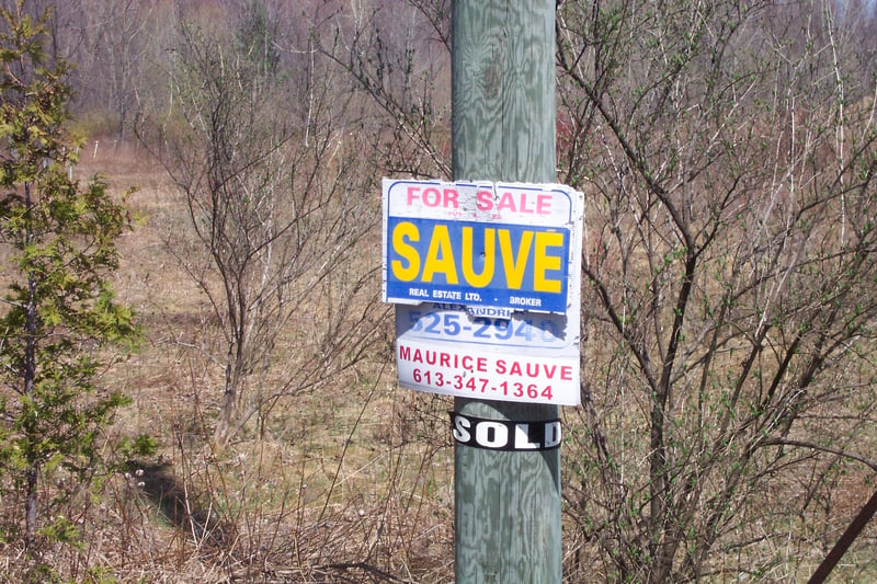 For sale sign posted on the property.