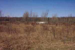 Field and projection building in the background.