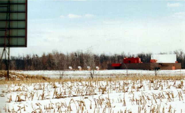 field, building, and screen